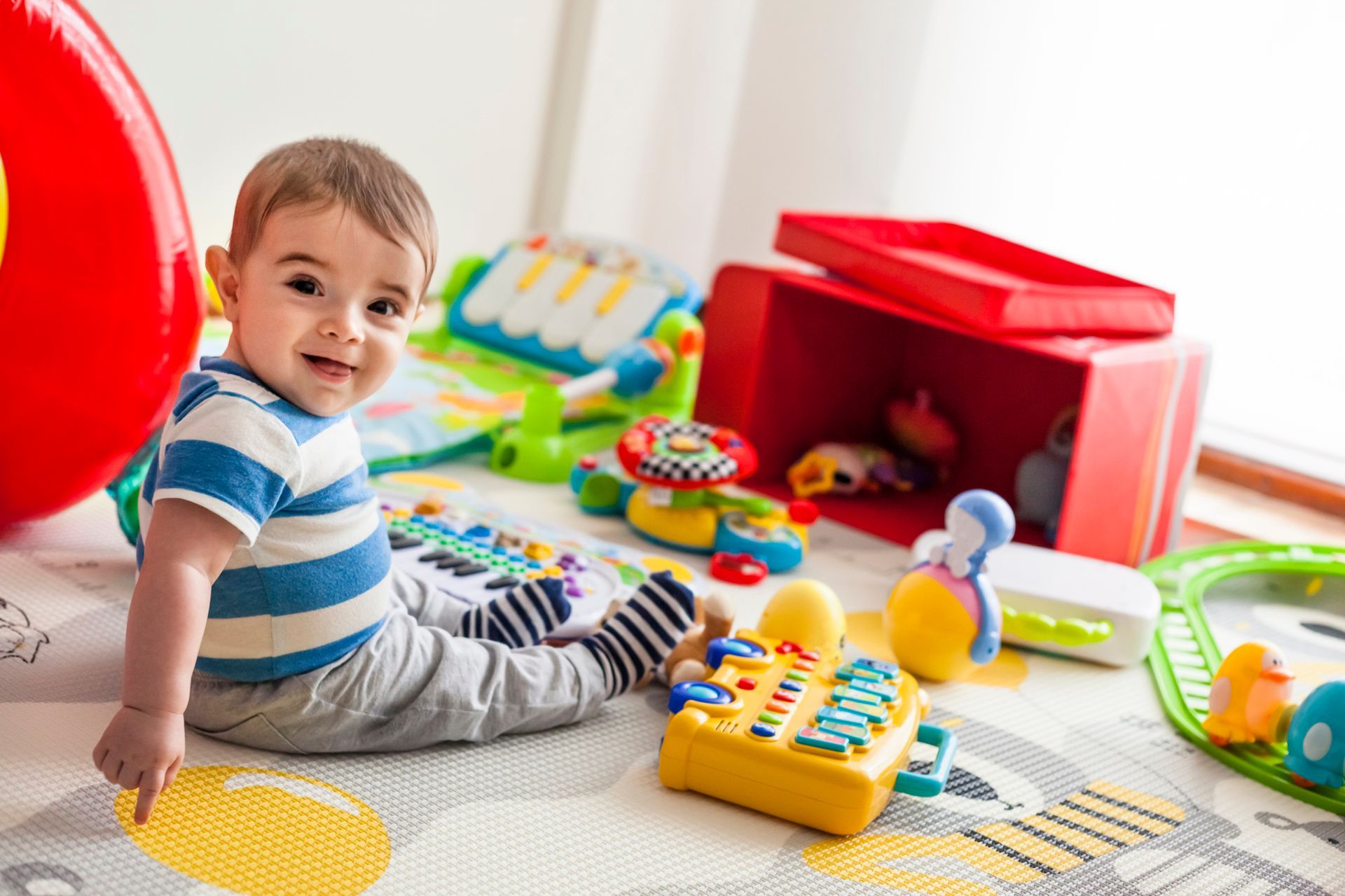 Baby Playing With Toys – Mendon, NY – Mendon Child Care Center