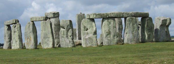 A row of stone pillars in a grassy field