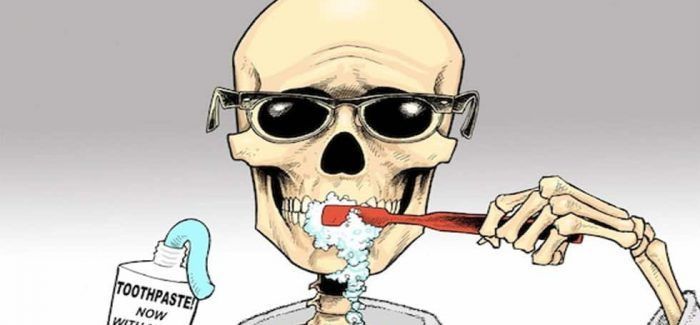 A cartoon of a skeleton brushing his teeth with toothpaste