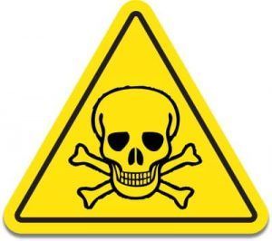 A yellow sign with a skull and crossbones on it