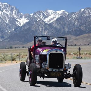 A purple car with a license plate that says 193-447