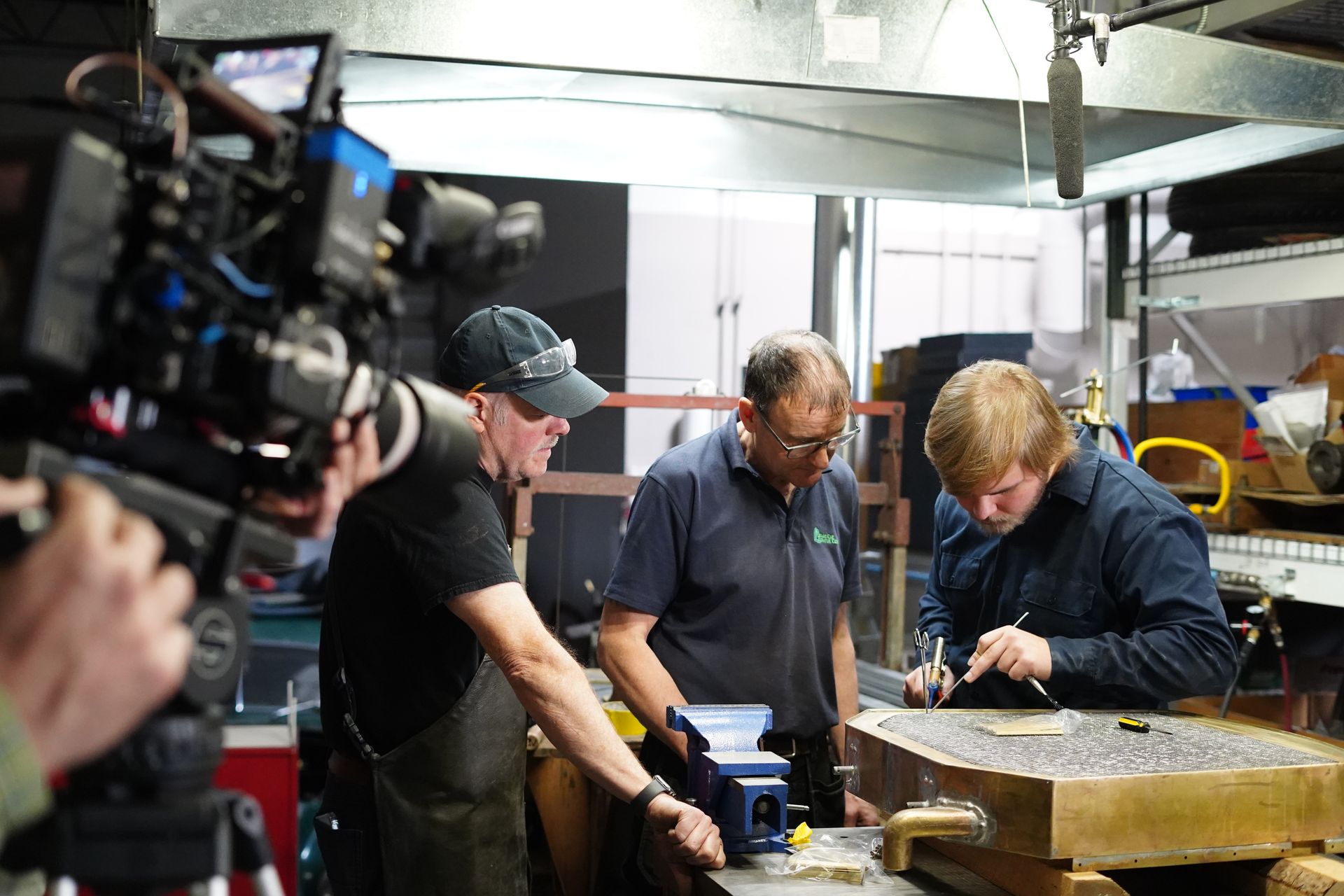 A sewing machine is sitting on top of a white table.