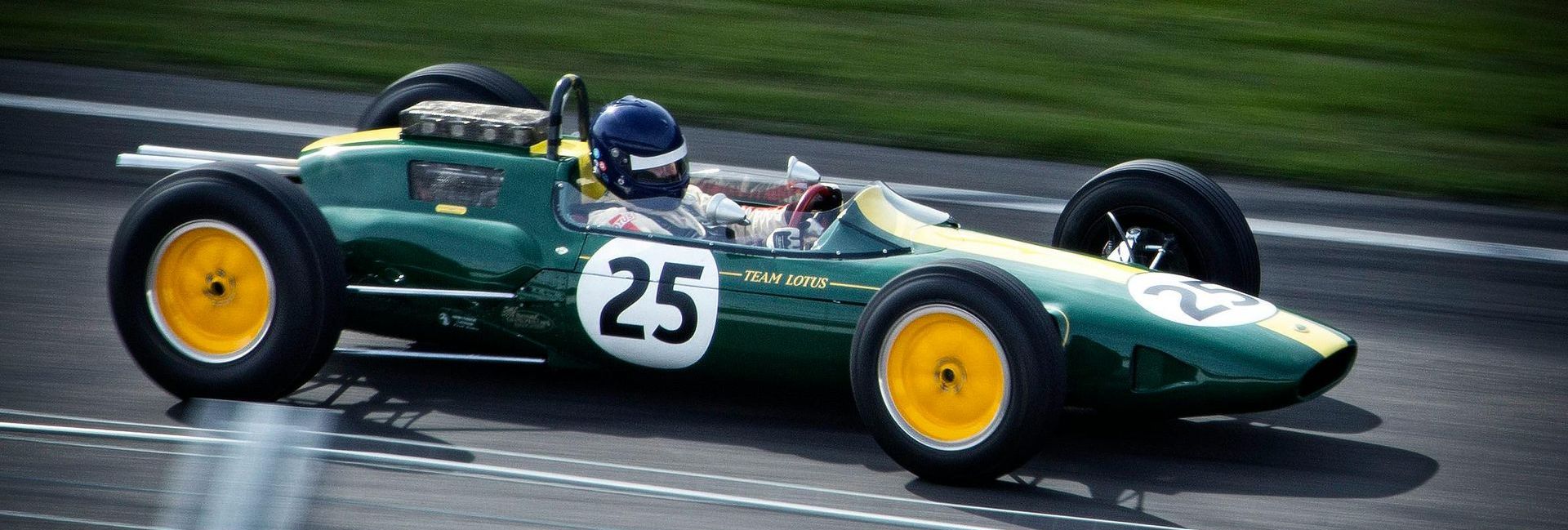 A green race car with the number 25 on it