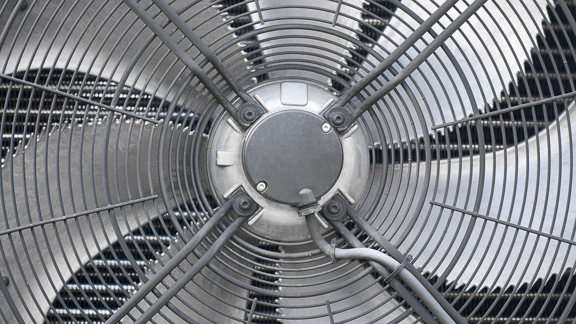 Metal fan with protective grill.