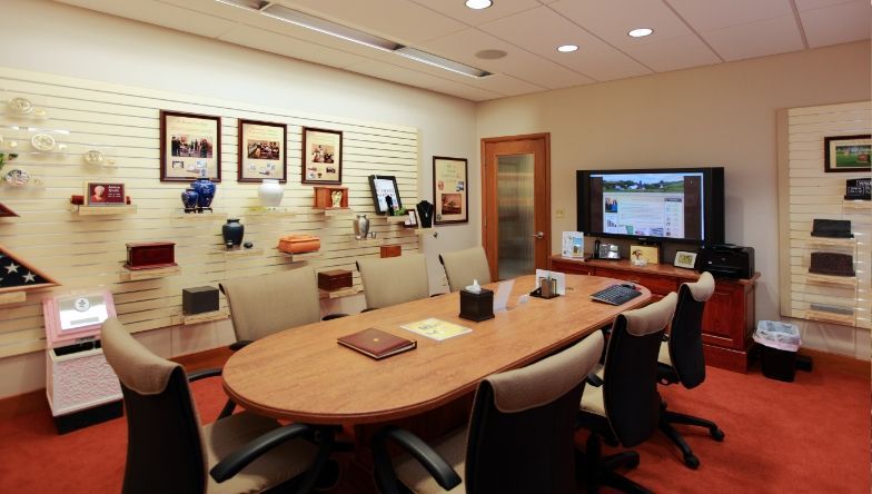 A conference room with a long table and chairs