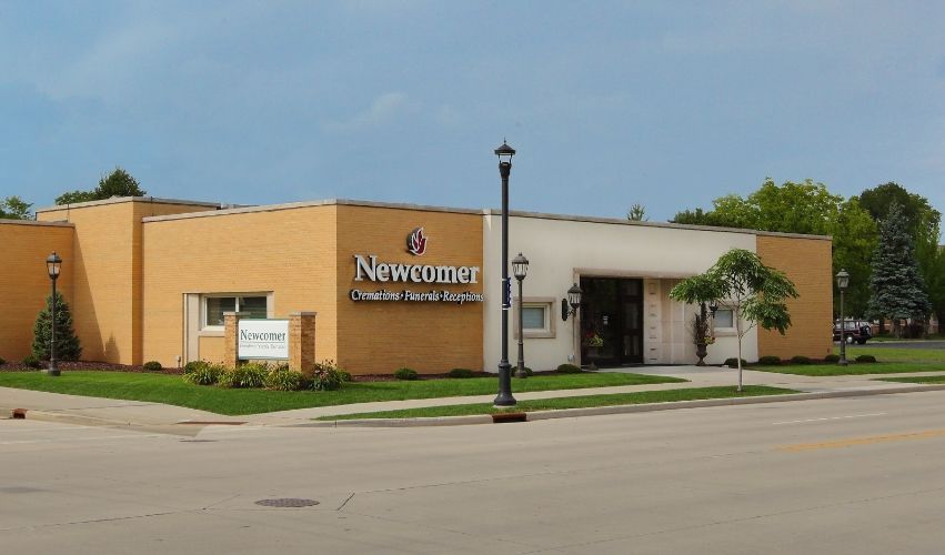 A large building with a flag in front of it