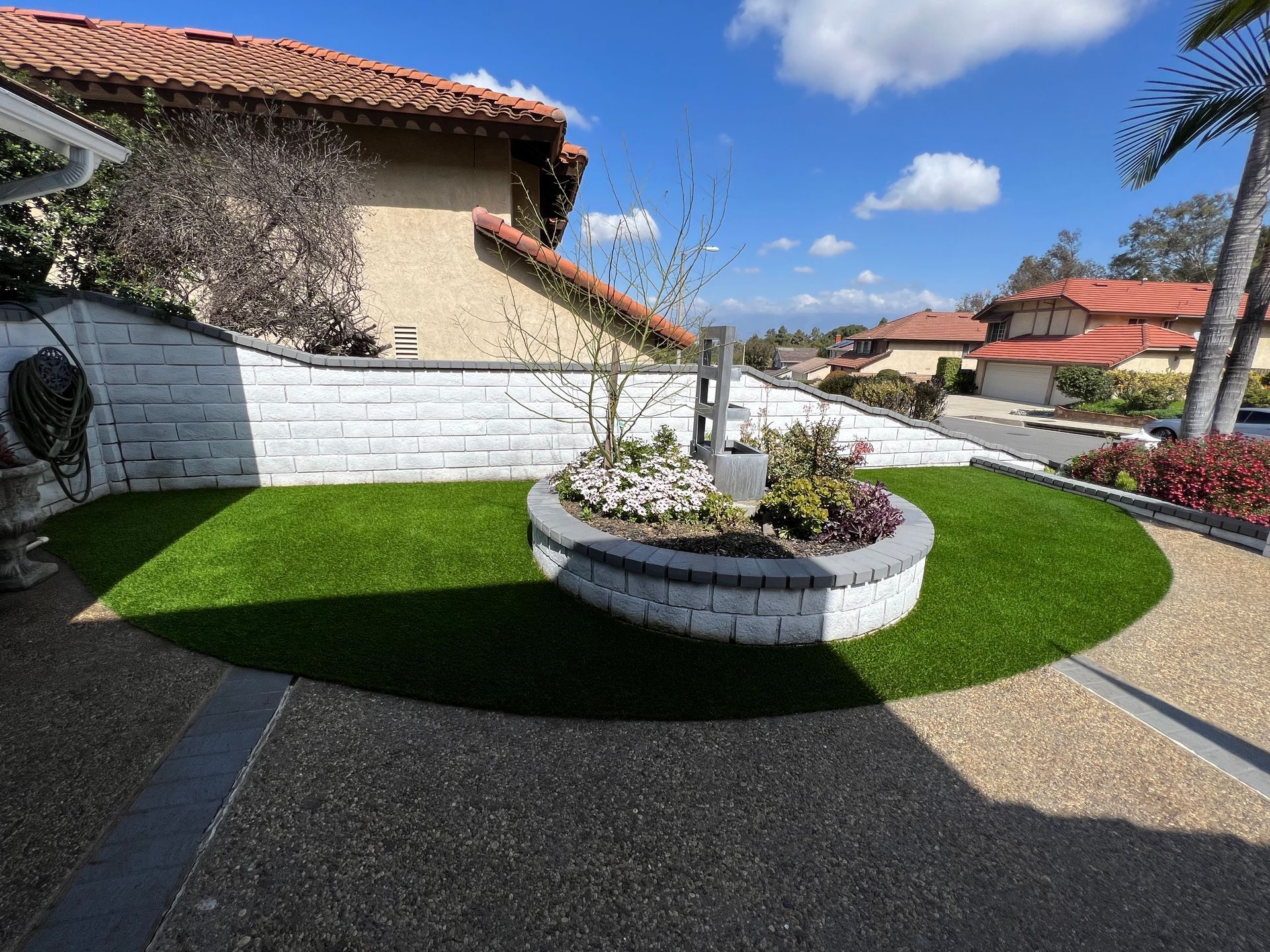 artificial grass around a planter