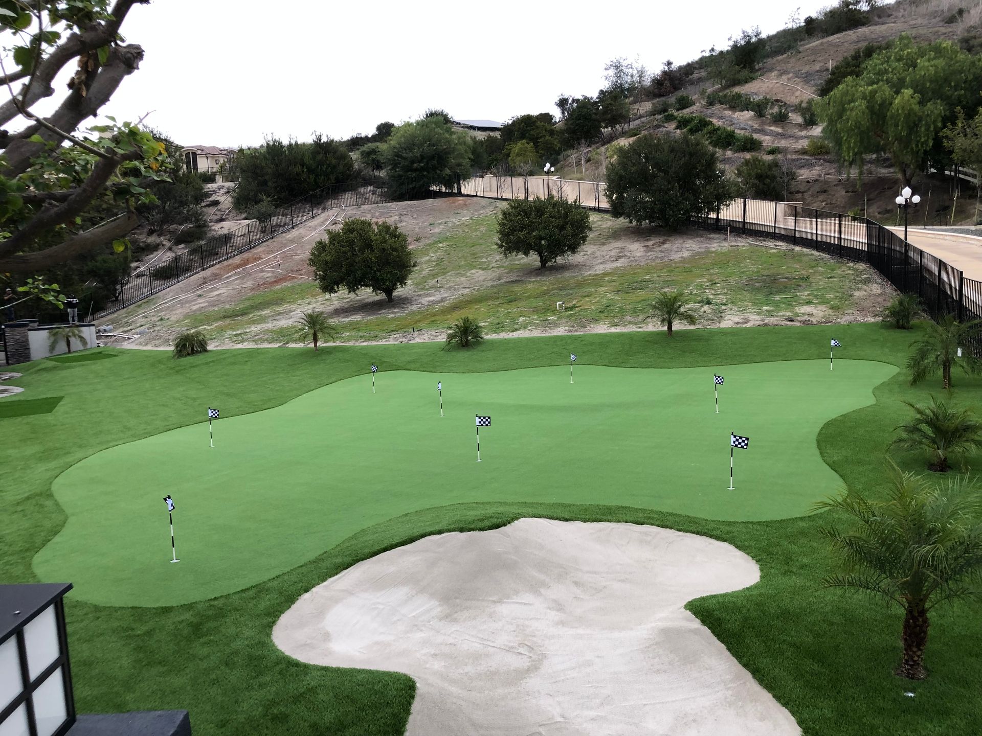large artificial putting green with sand trap