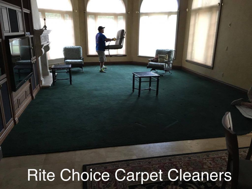 Before Image of a Living Room With Old Carpet