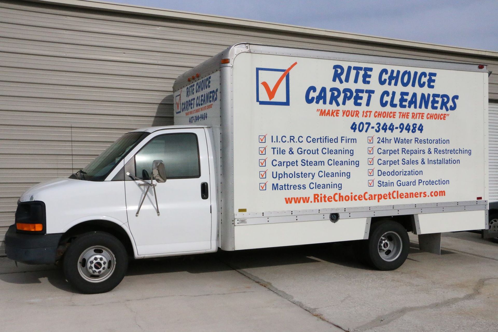 A rite choice carpet cleaners truck is parked in front of a building