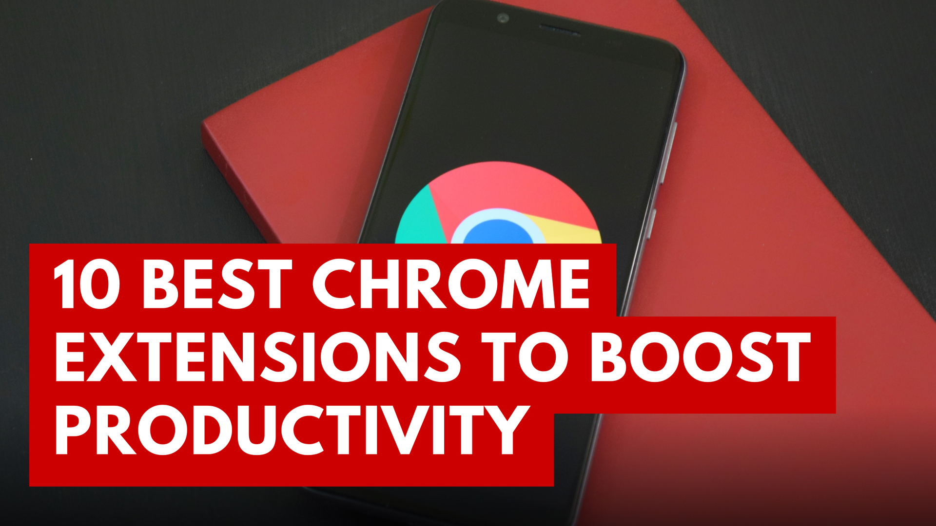 A cell phone is sitting on top of a red book with the best chrome extensions.