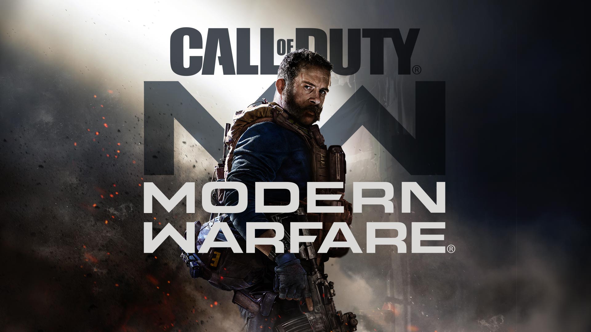 A man with a beard is standing in front of a call of duty modern warfare logo.