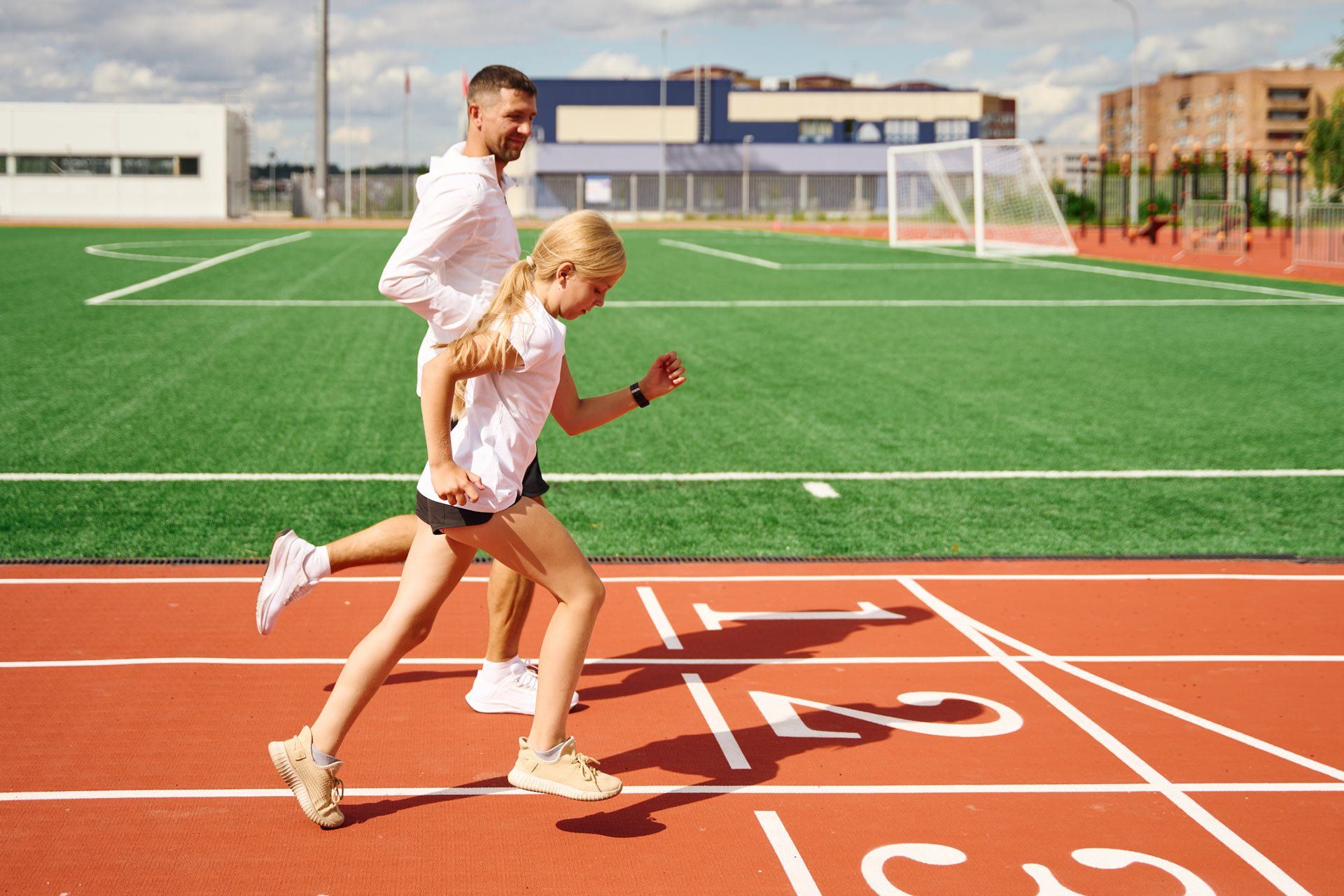 Father with Daughter Together Running on Track and Field Stadium | Wembley, Wa | Wembley Podiatry
