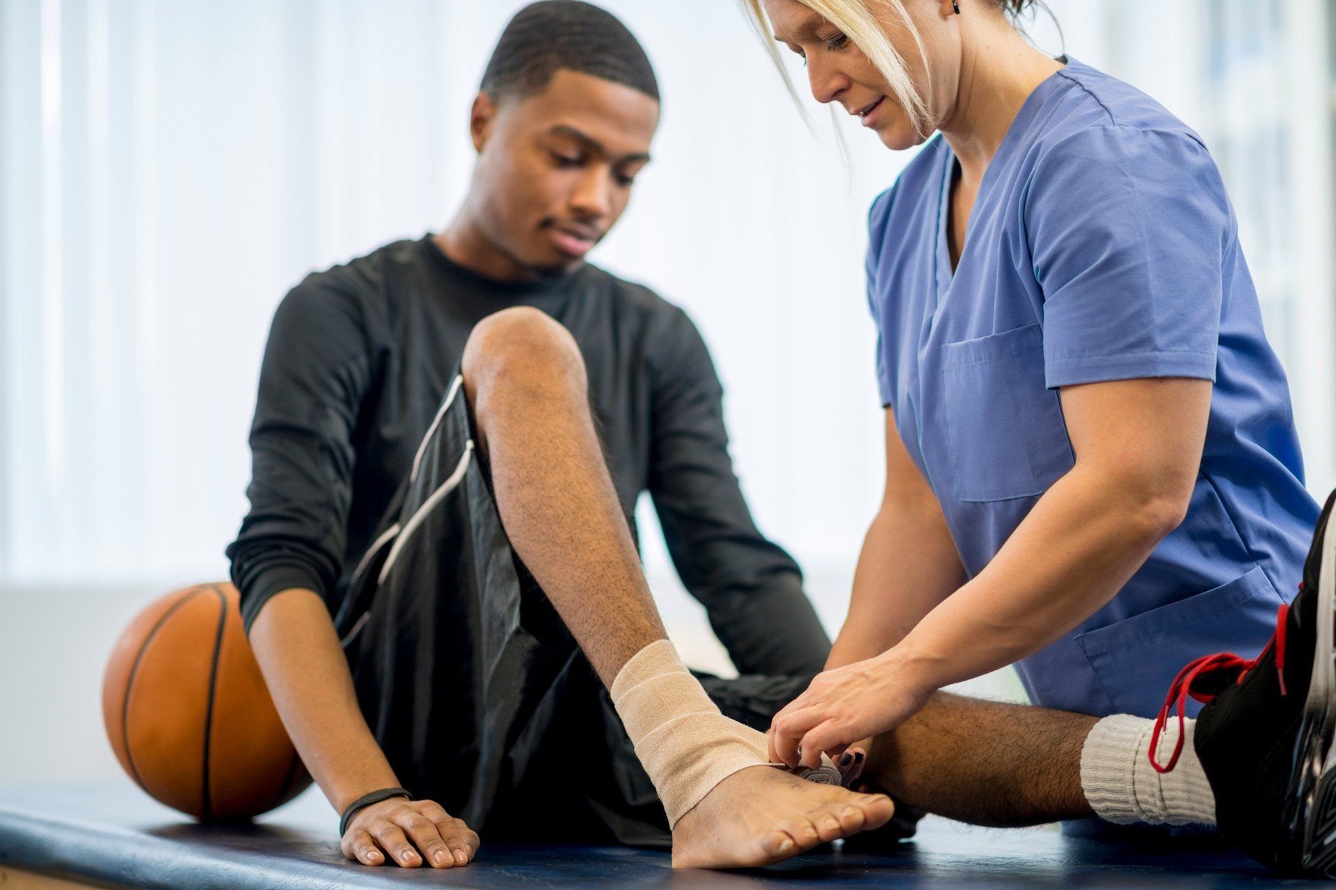 A Male Teenage Basketball Player Is at the Doctor's Office to Have Some Work Done on His Injury | Wembley, Wa | Wembley Podiatry