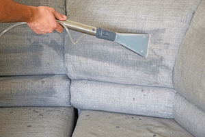 A carpet cleaning nozzle performing sofa cleaning. Sofa Cleaning South London.
