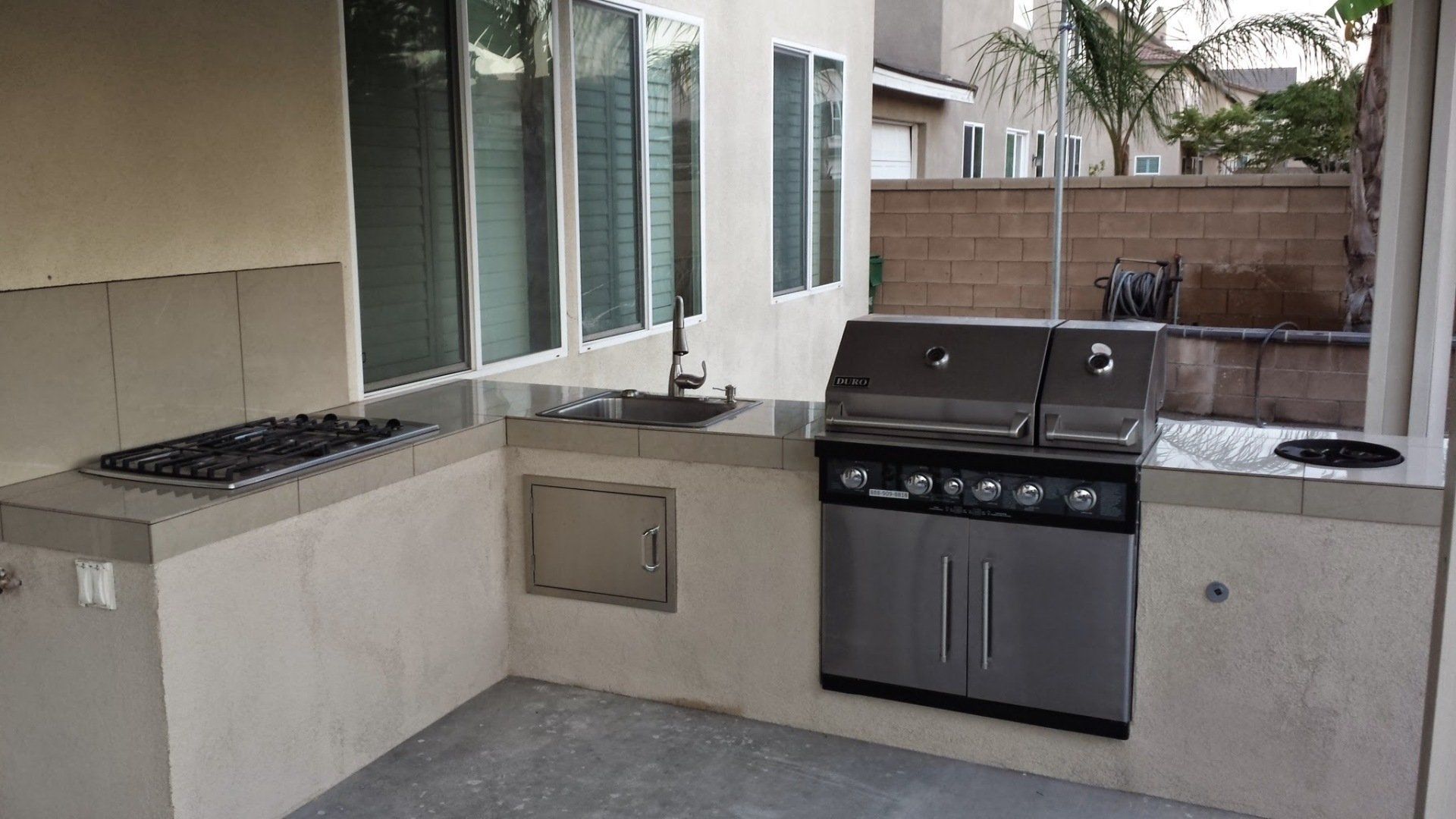 A kitchen with a grill and stove in it