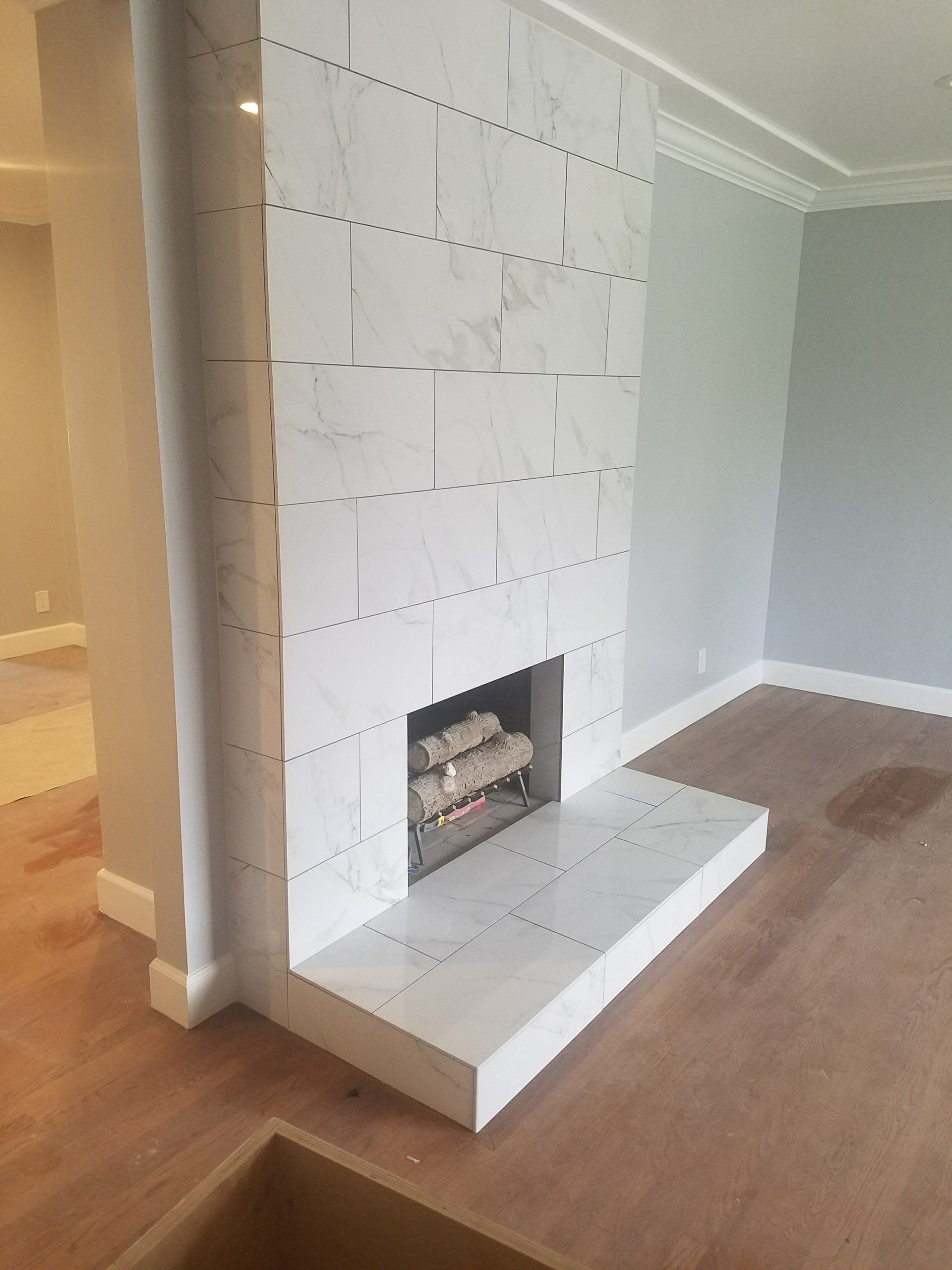 There is a fireplace in the middle of the room.