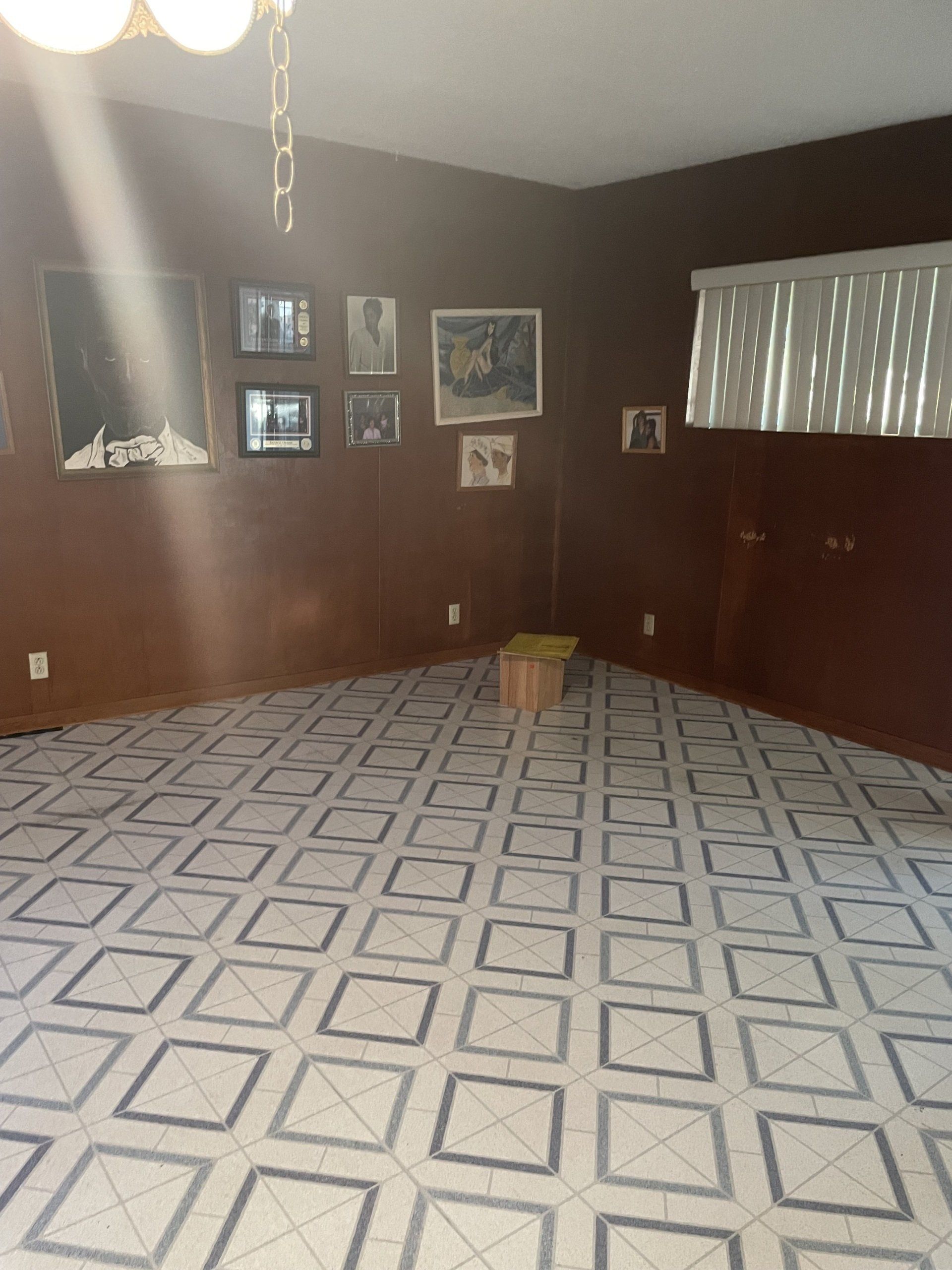 A room with a geometric pattern on the floor and walls.