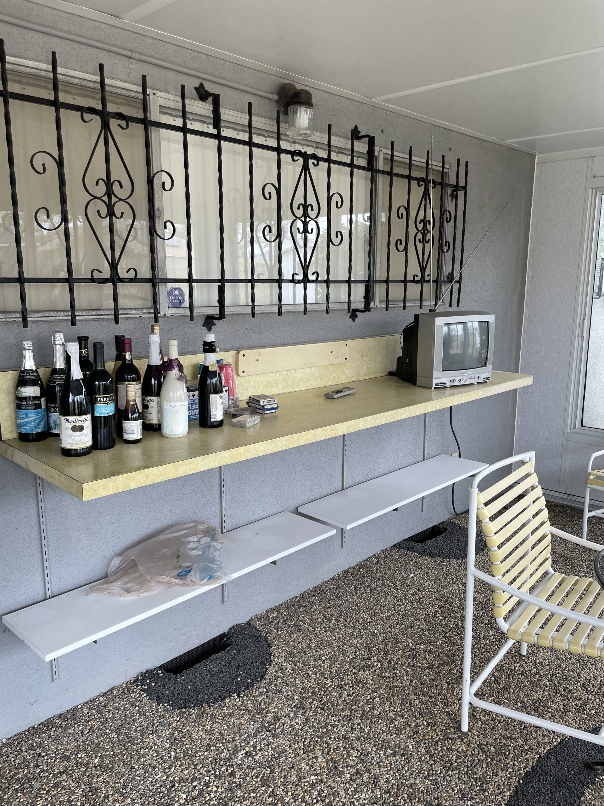 A table with many bottles of alcohol on it