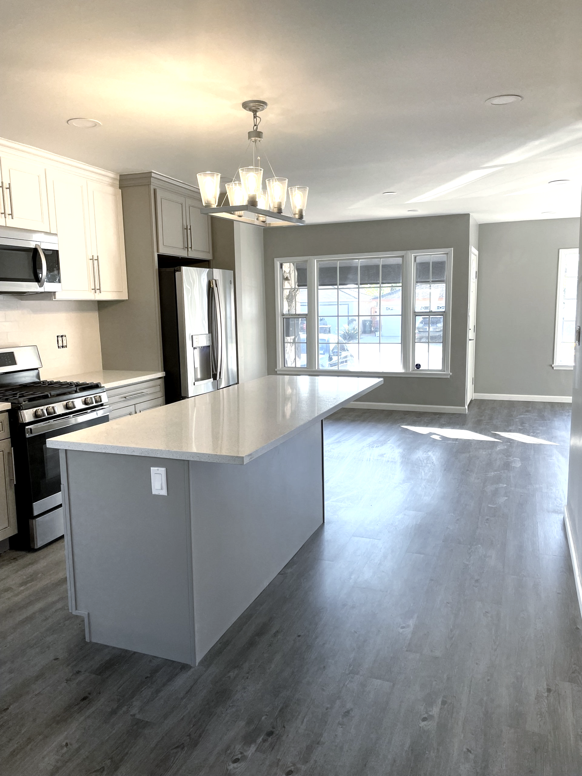There is a large island in the middle of the kitchen.