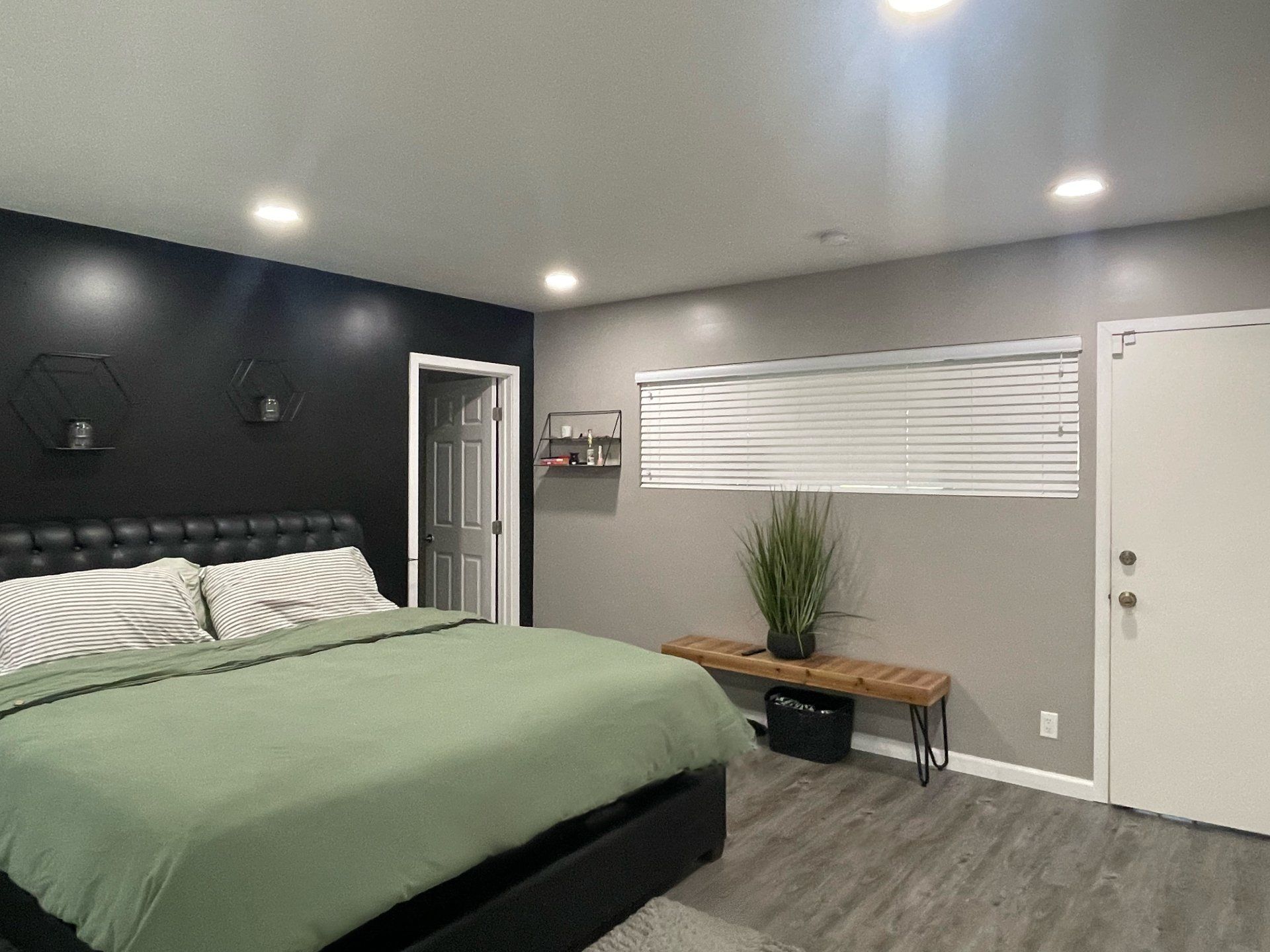 There is a large bed in the middle of the room.