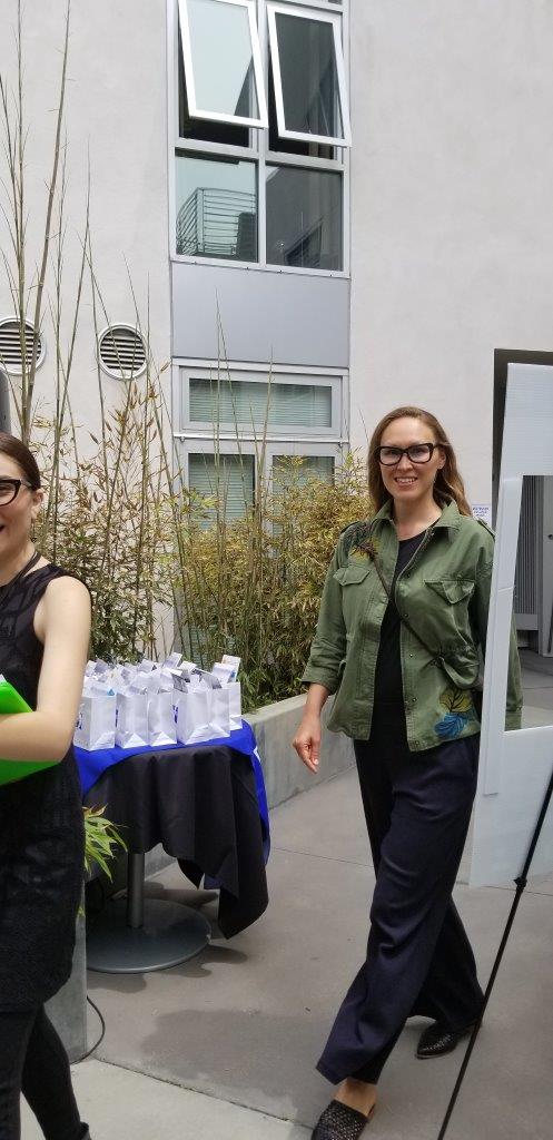 Shopper smiling and posing at Raise Your Glasses 2019 Event