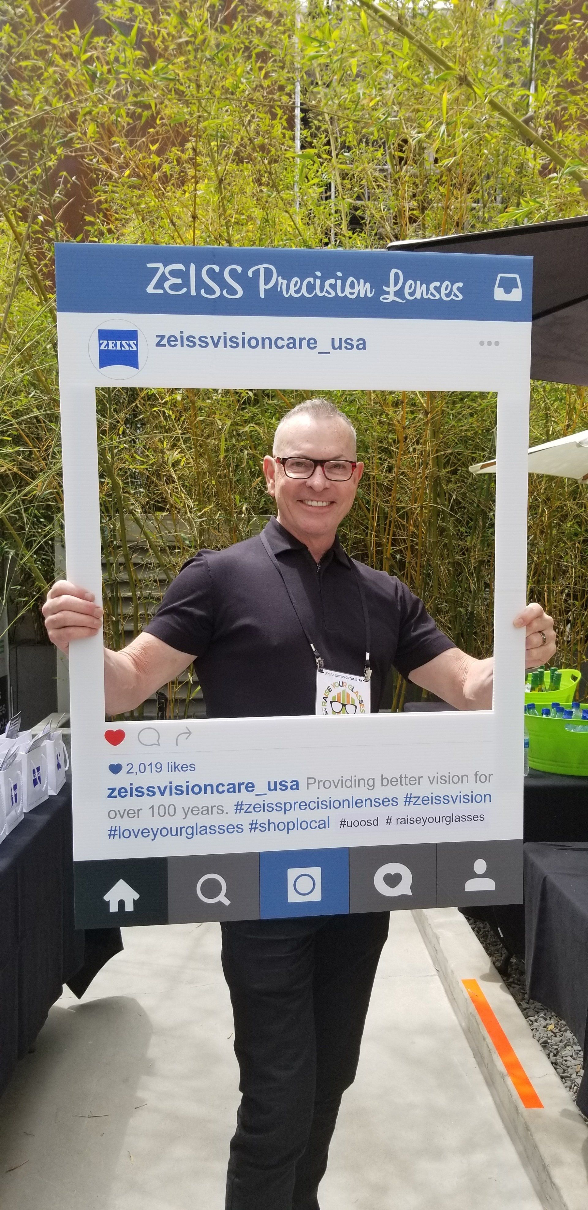 Person wearing glasses posing in large social media post template at Raise Your Glasses 2019 Event