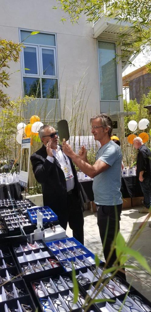 2 people chatting about frames at Raise Your Glasses 2019 Event