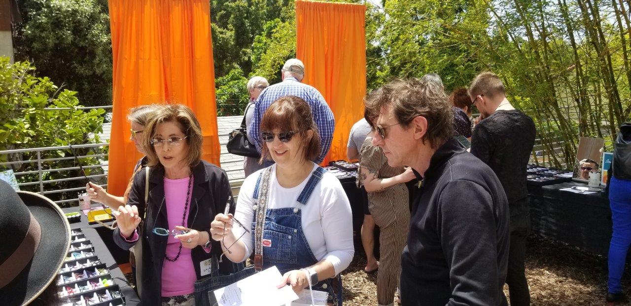 Person trying on frames at Raise Your Glasses 2019 Event