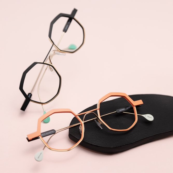 Two Anne et Valentin metal frames, one in rose gold and one in gun metal black with gold temples