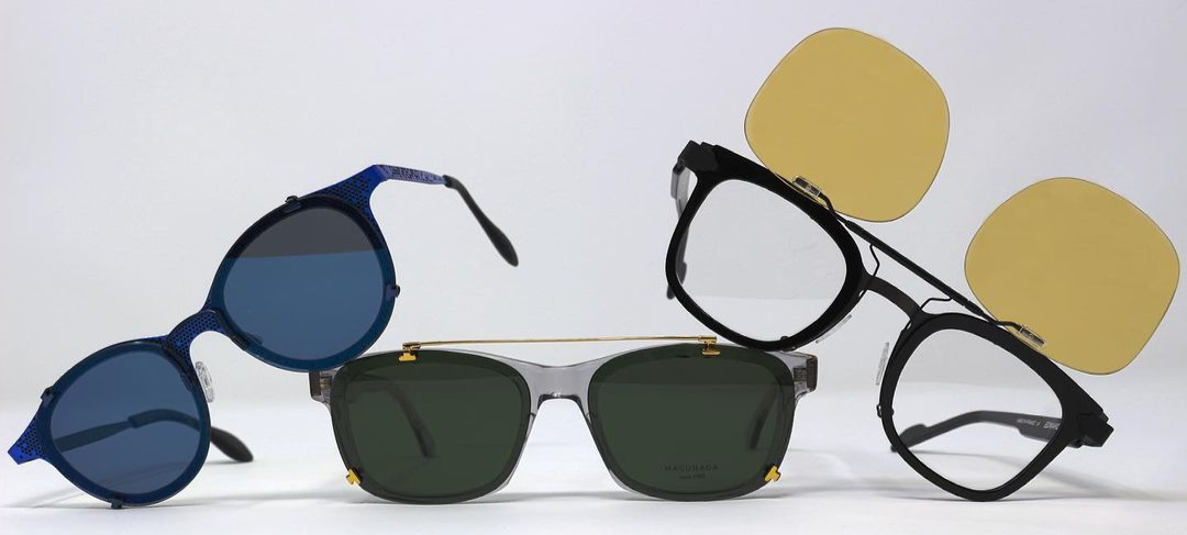 Three glasses with eclip custom clip-on sunglasses different models and colors