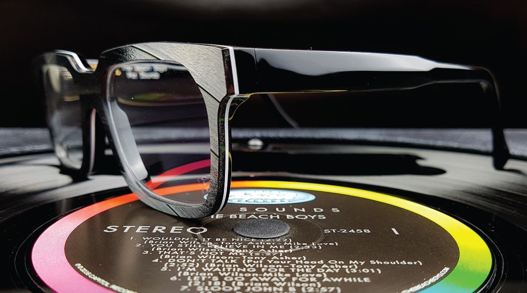 A pair of Vinylize glasss sittingon a vinyl record
