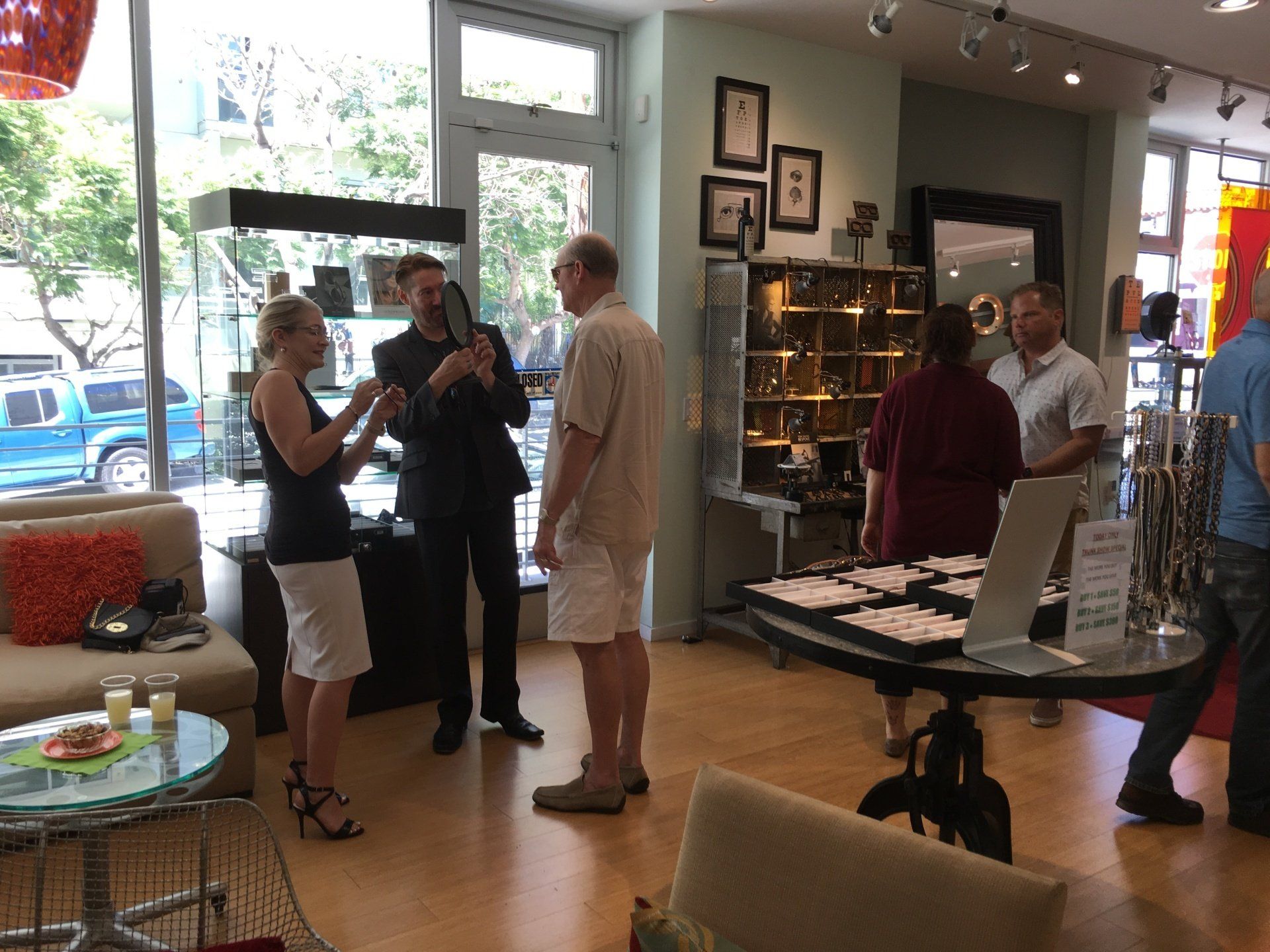 3 people standing inside Urban Optiks Optometry at 2016 trunk show event