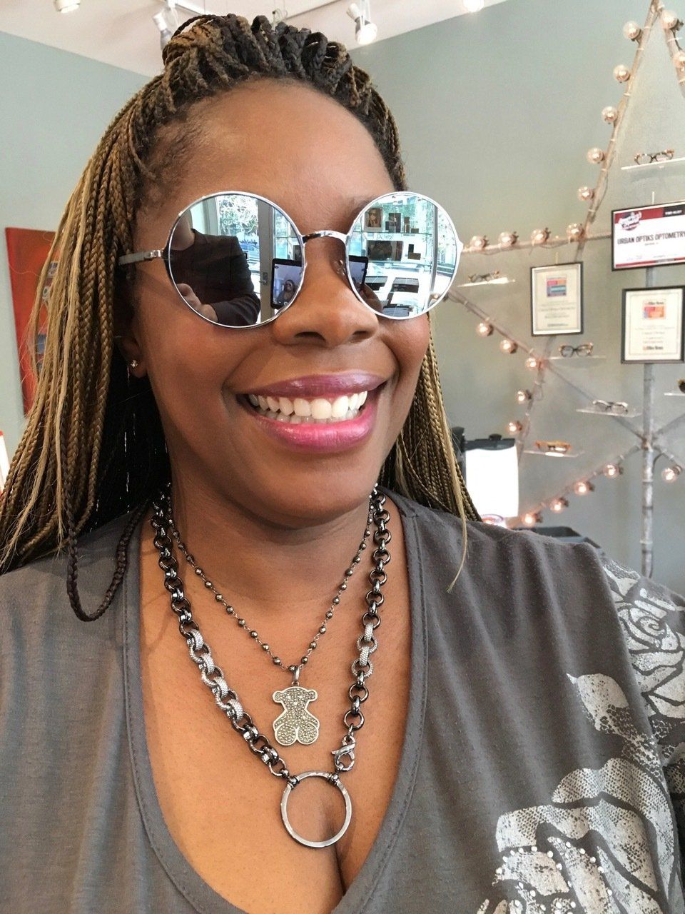 Person modeling sunglasses at 2016 trunk show event