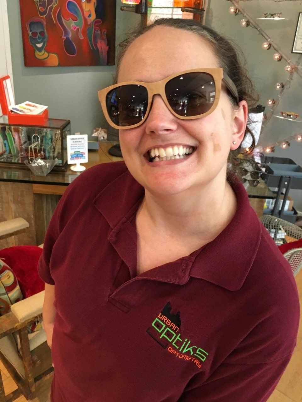 Woman modeling sunglasses at Gold & Wood and Tom Davies Trunk Show