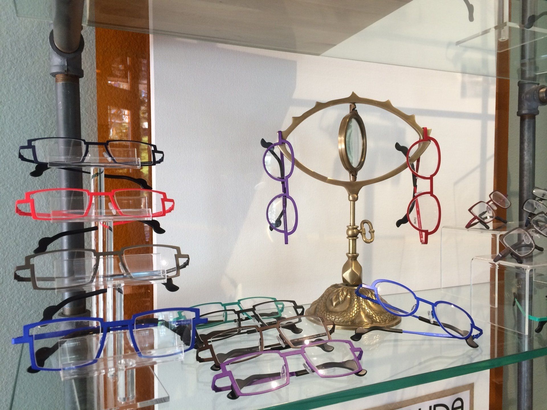 Colorful frames on display at Theo Trunk Show event at Urban Optiks