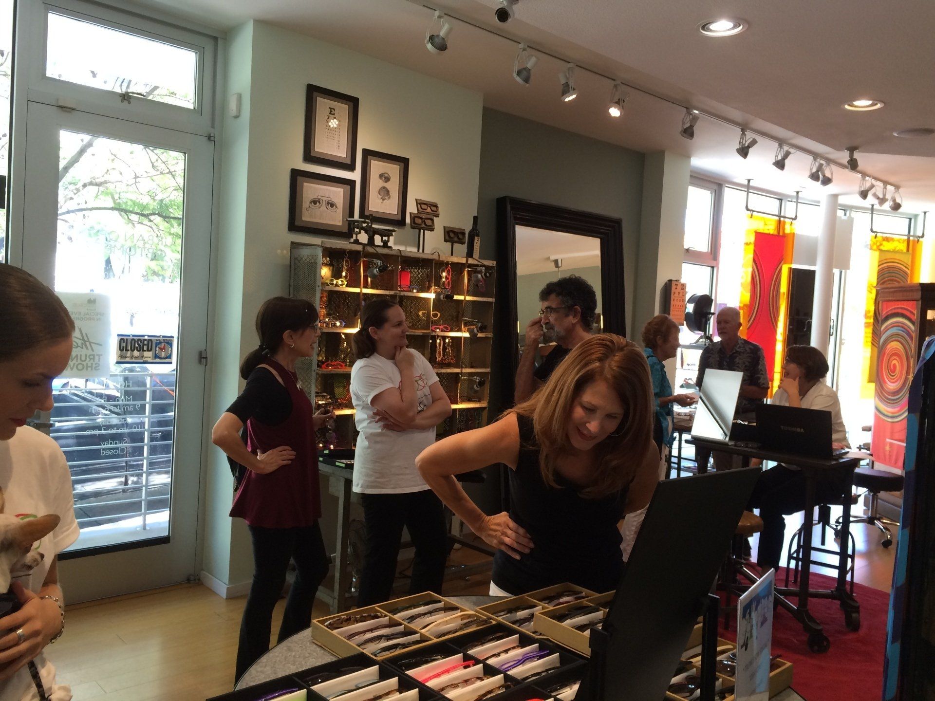 Many people looking at frames at Theo Trunk Show event at Urban Optiks