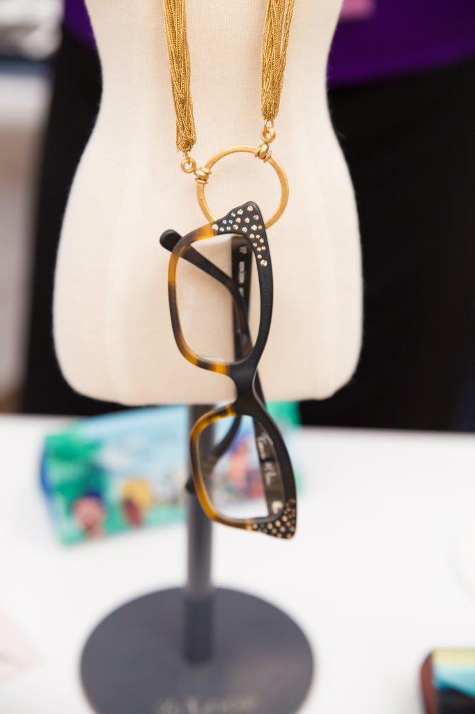 Eyeglass frames on loop on display stand at 2018 Raise Your Glasses