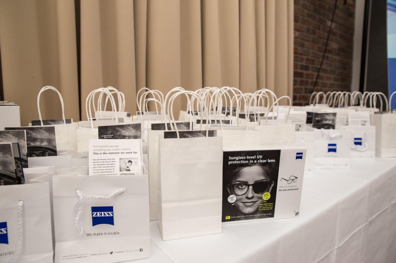 Small shopping bags with event swag at Raise Your Glasses 2018 Event