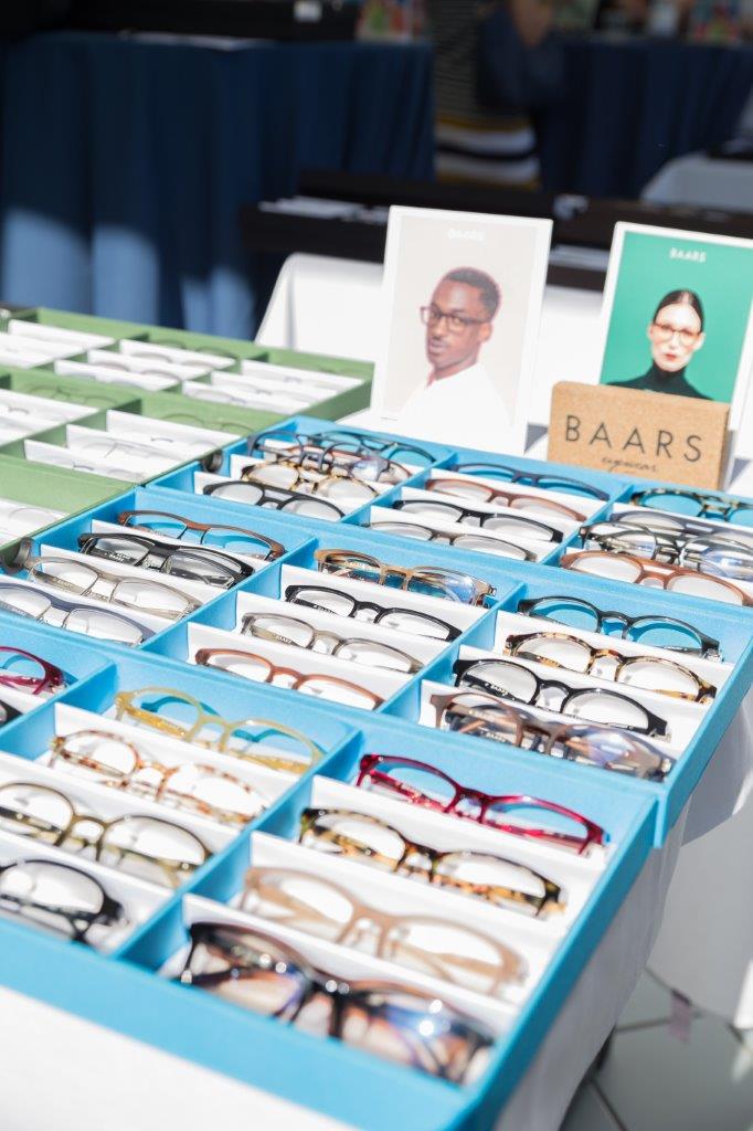 Blue display boxes of framelines at outdoor table at Raise Your Glasses 2018 Event