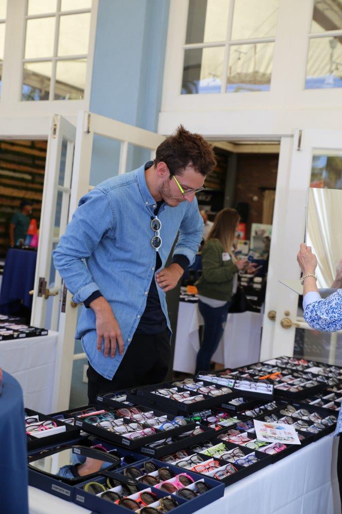 Attendee looking at frameline selections at Raise Your Glasses 2018 Event