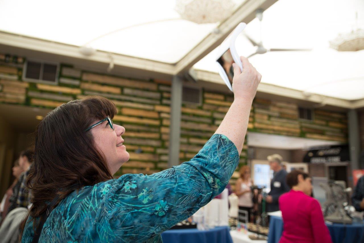 Person trying on frames at Raise Your Glasses 2018 Event