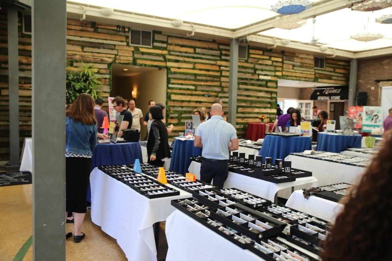 View of indoor tabletop frameline displays at Raise Your Glasses 2018 Event