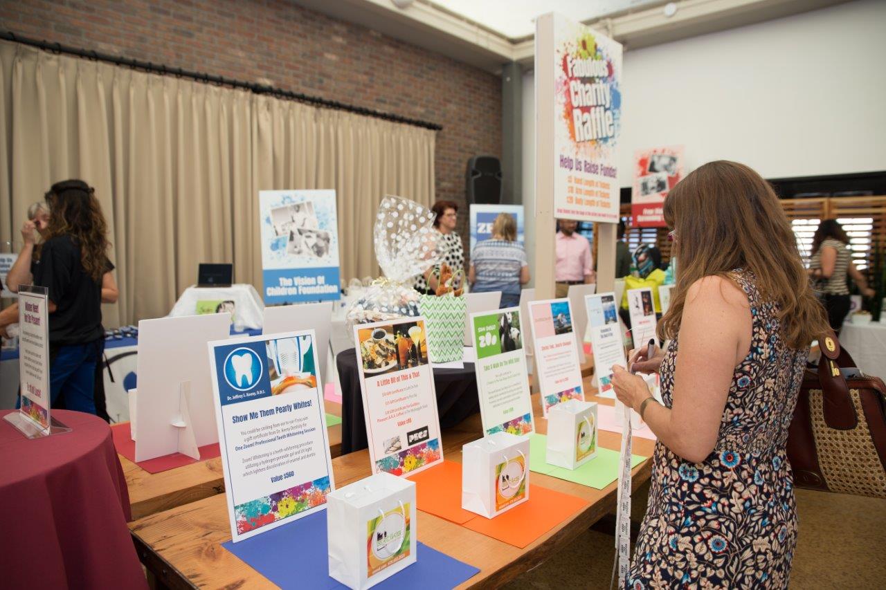 Tabletop display of drawing prizes at Raise Your Glasses 2018 Event