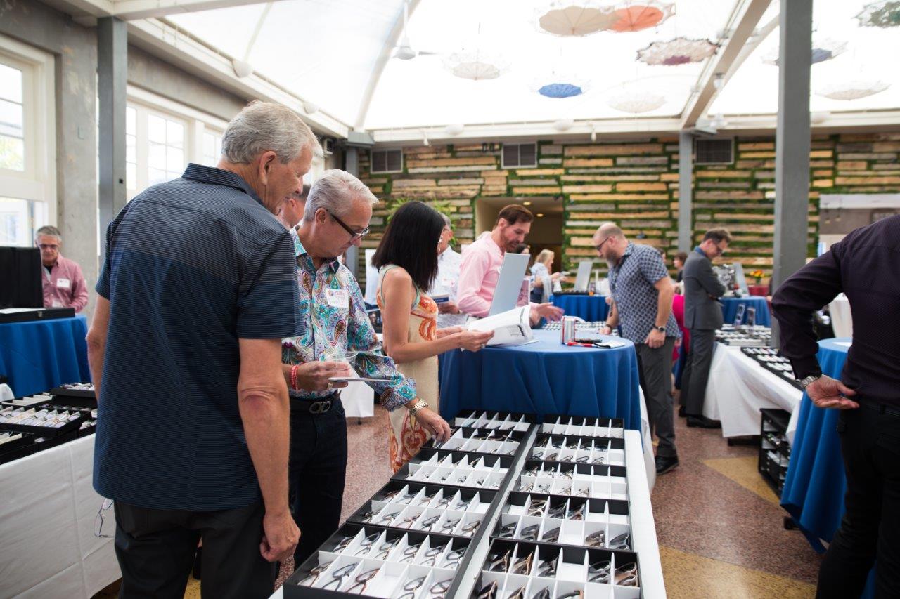 People viewing eyewear at Raise Your Glasses 2018 Event