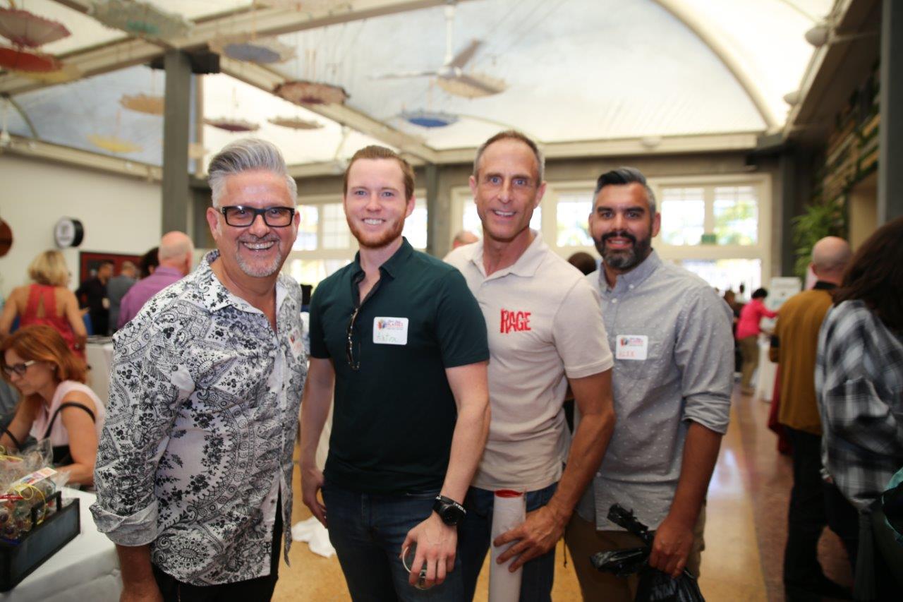 4 guests posing at Raise Your Glasses 2018 Event
