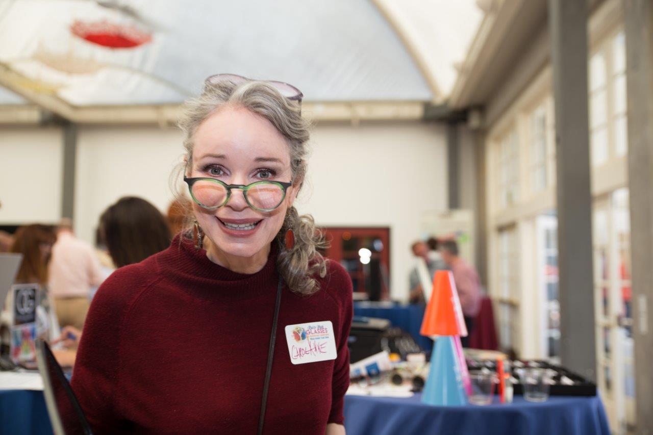 Person smiling and posing for camera at Raise Your Glasses 2018 Event