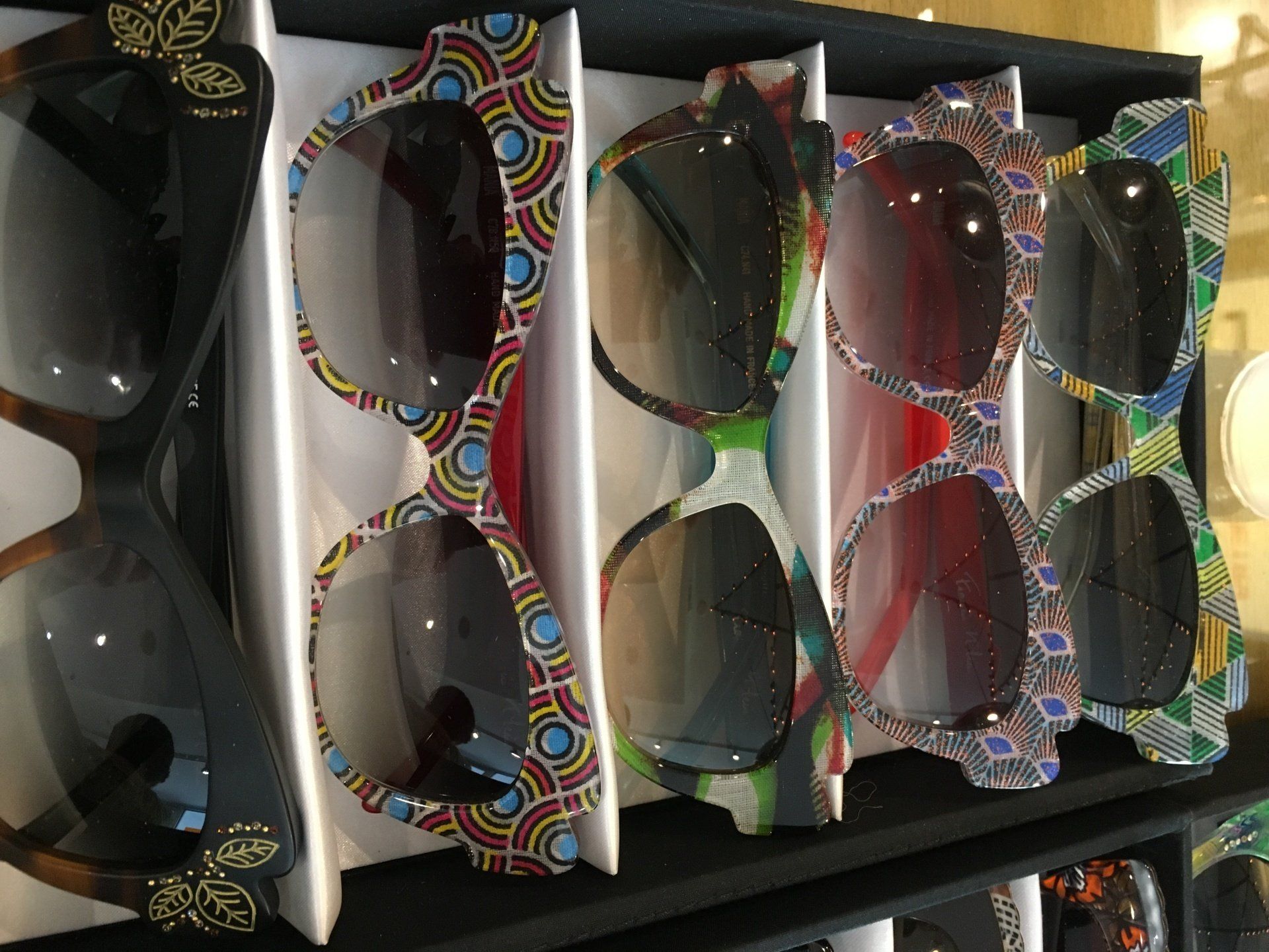 5 sunglass frames in display box at 2017 Francis Klein Trunk Show