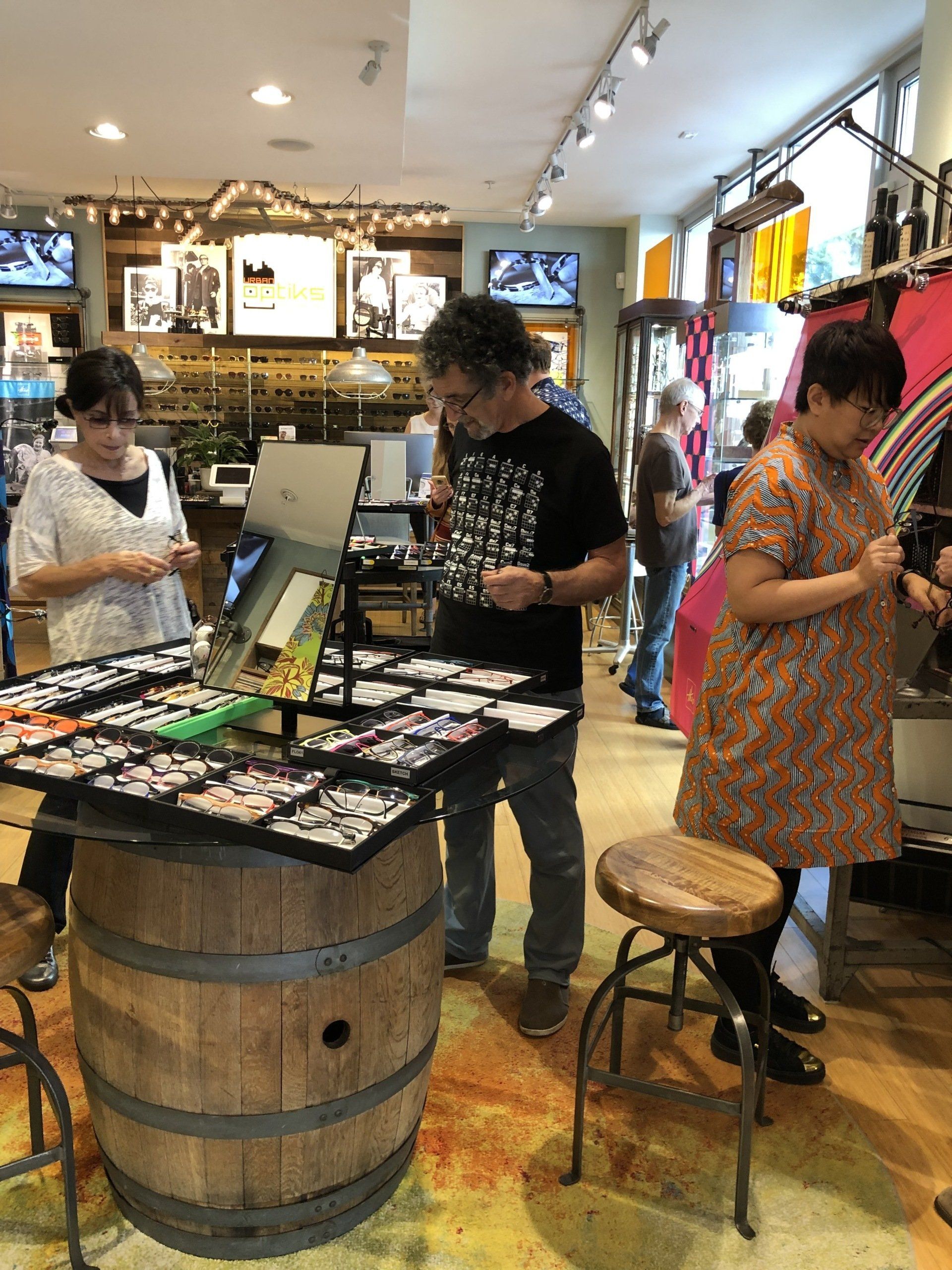 Three people shopping for frames at Theo Trunk Show Event