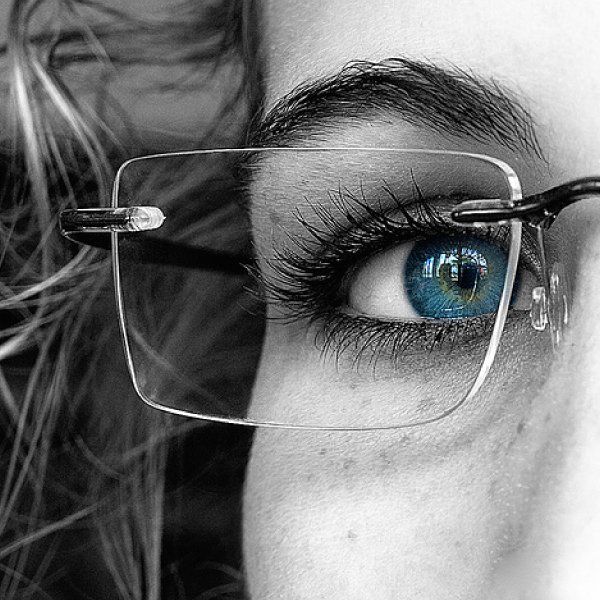 Closeup of a frame on a woman showing a single Zeiss custom digital lens